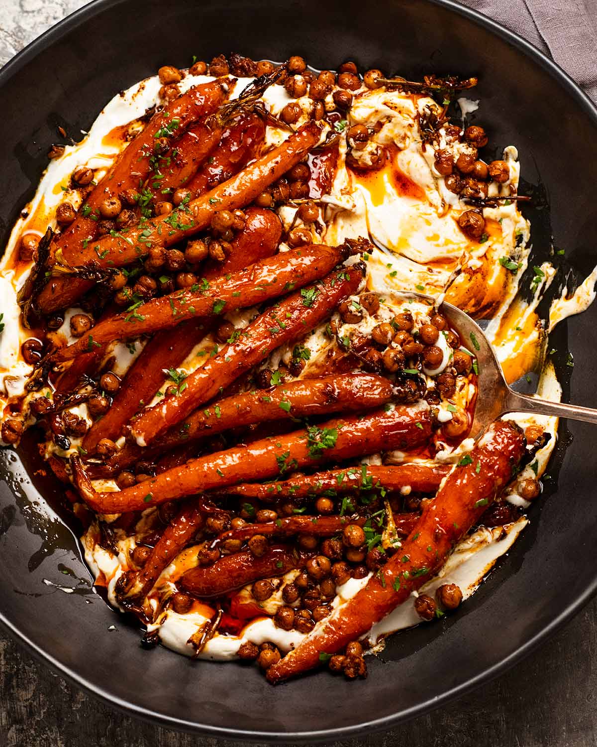 Spicy maple roast carrots with crispy chickpeas and yogurt sauce